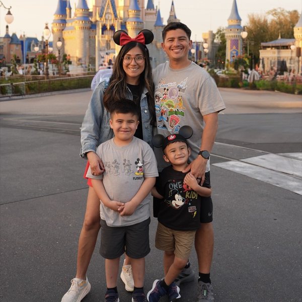 Lee with his wife and two sons at Disney World